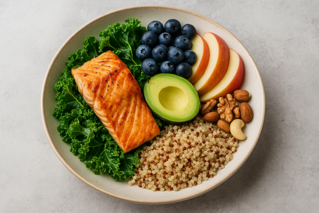 Balanced meal with salmon, kale, avocado, fruits, quinoa, and nuts for type 2 diabetes reversal